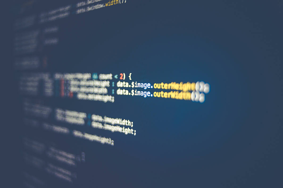 A close up of a screen with many coding lines